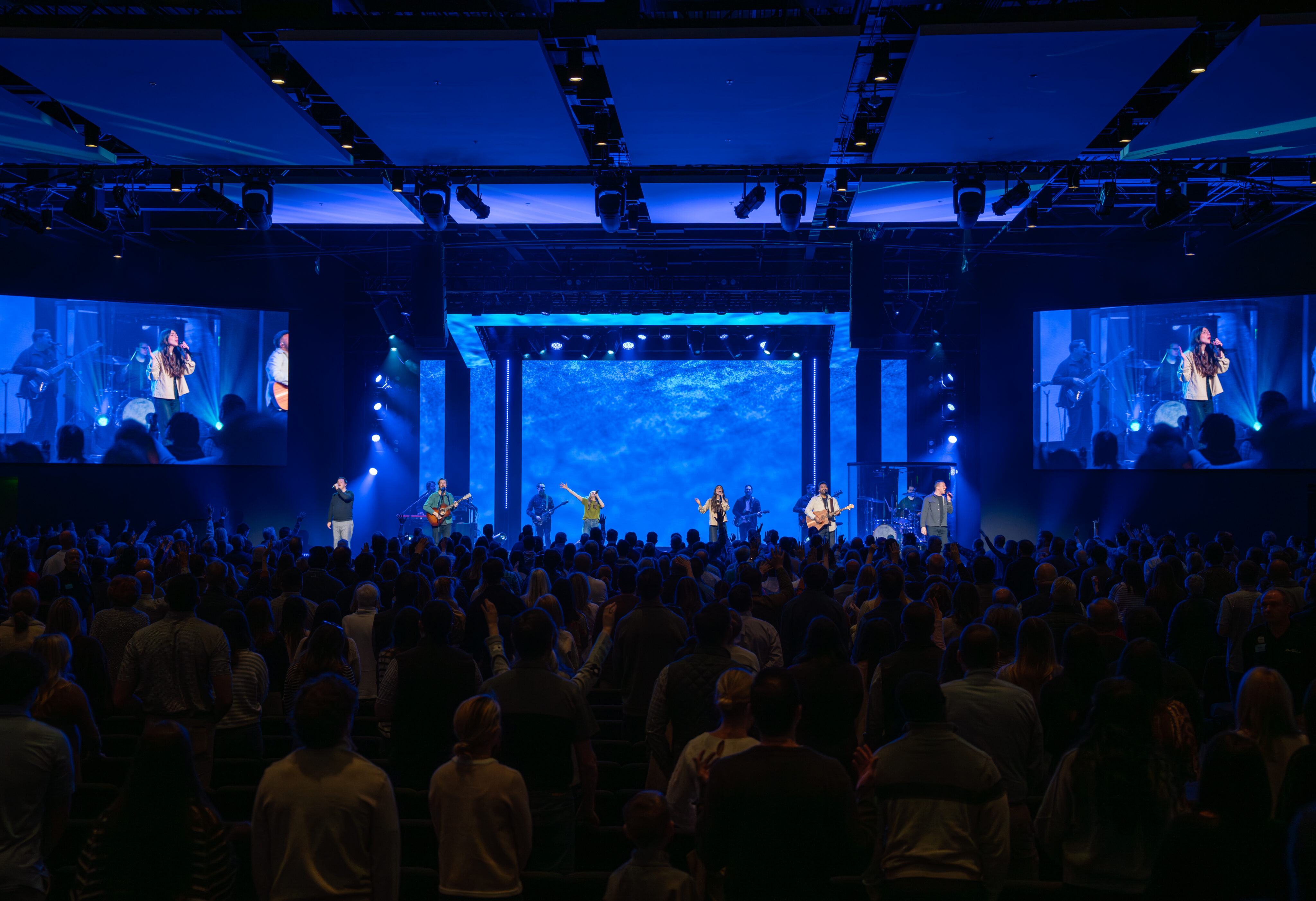 Audience view of a live worship concert at Church of the Highlands with the band performing on stage.