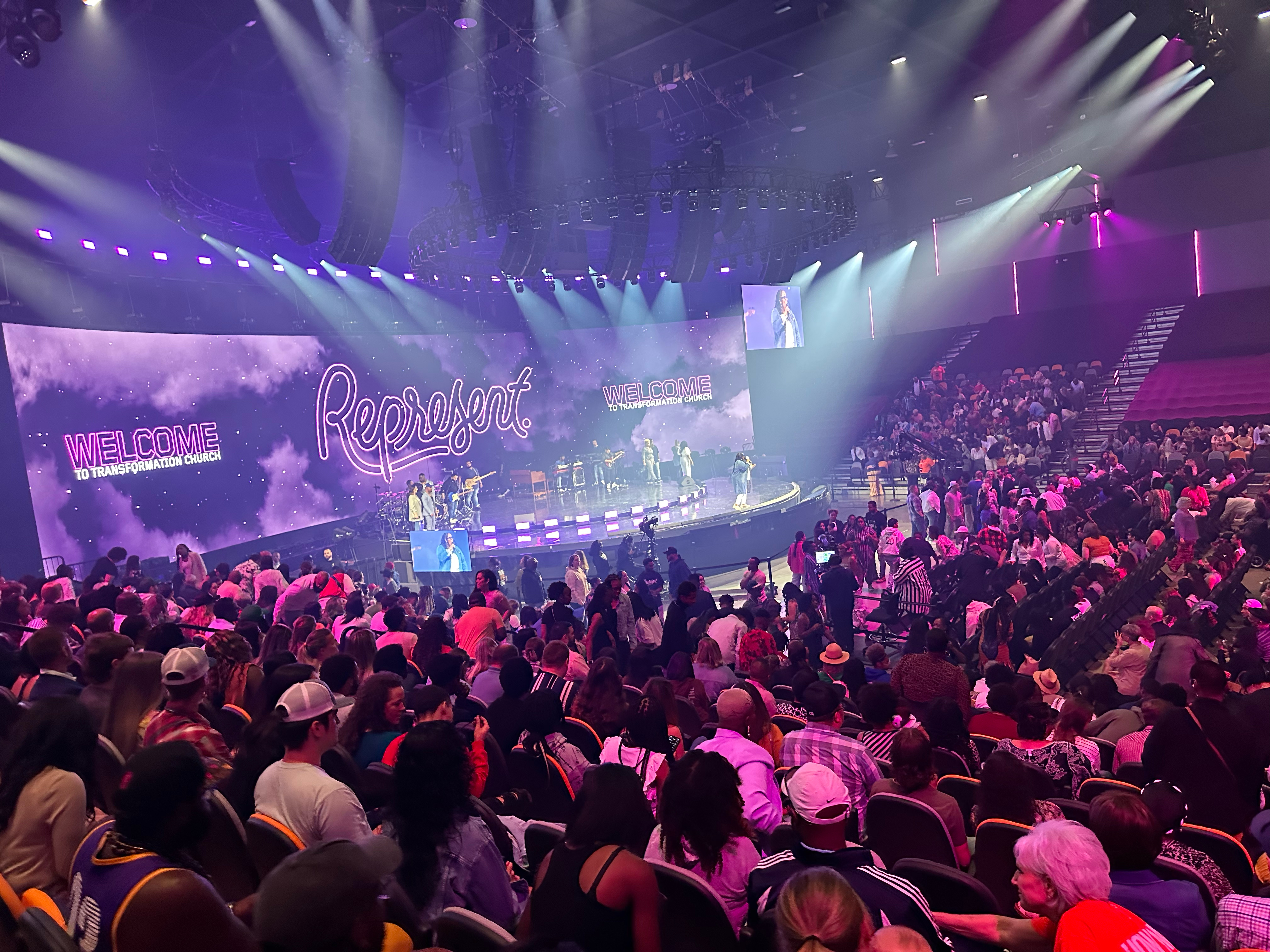 Live worship concert at Transformation Church with a band performing on stage, audience in attendance, and Ross Video graphics displayed behind the performers.