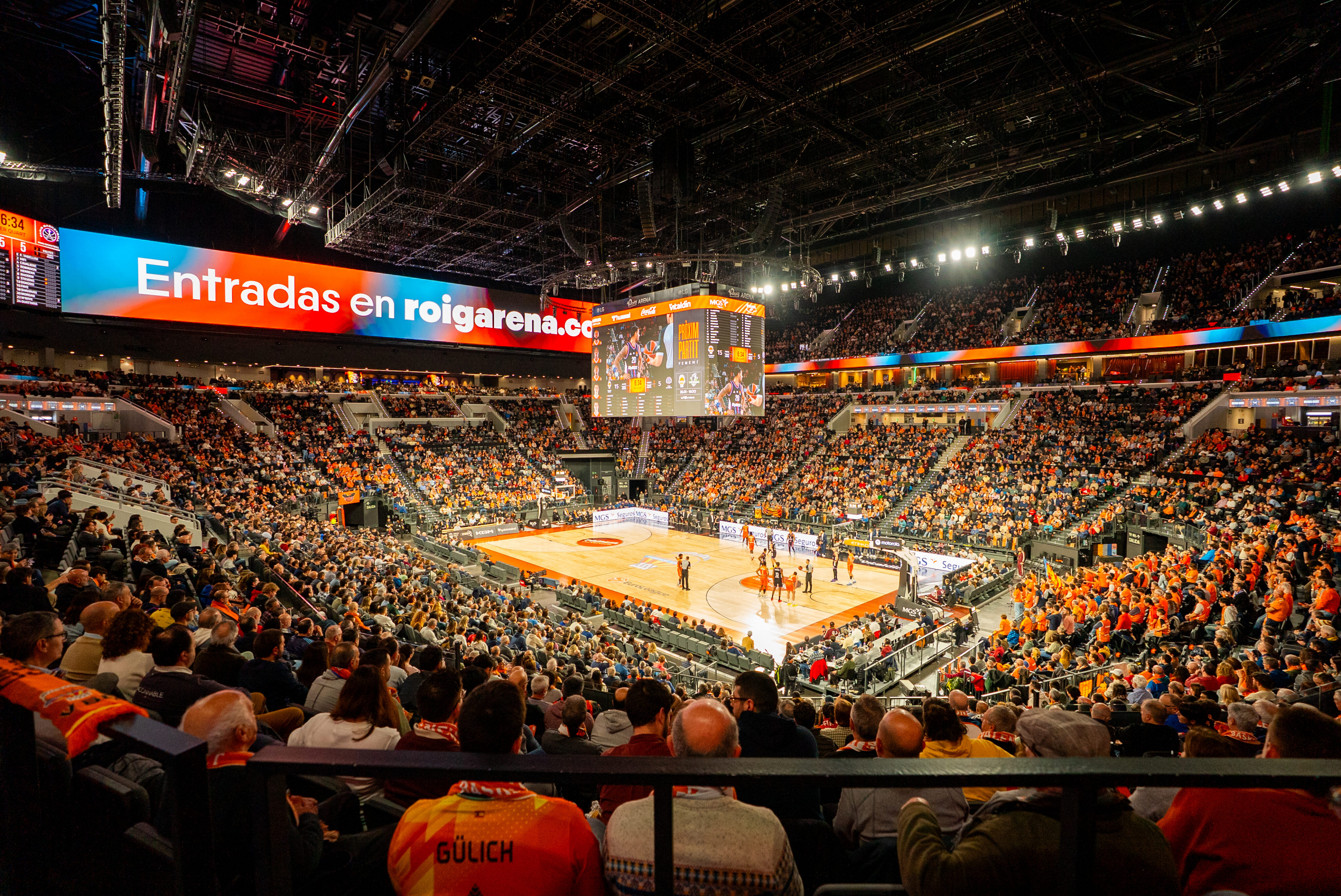 Basketball game inside Roig Arena with Ross Video graphics displayed across LED screens and arena displays.